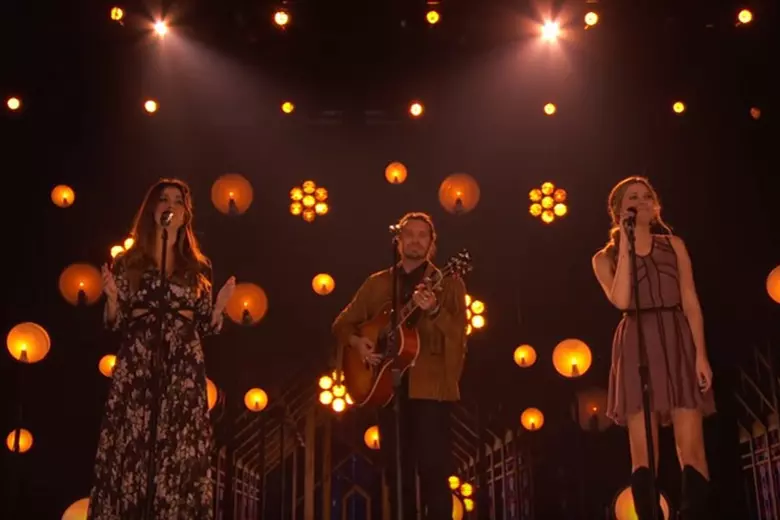 The Edgar Family Band performing amid floating candle lights